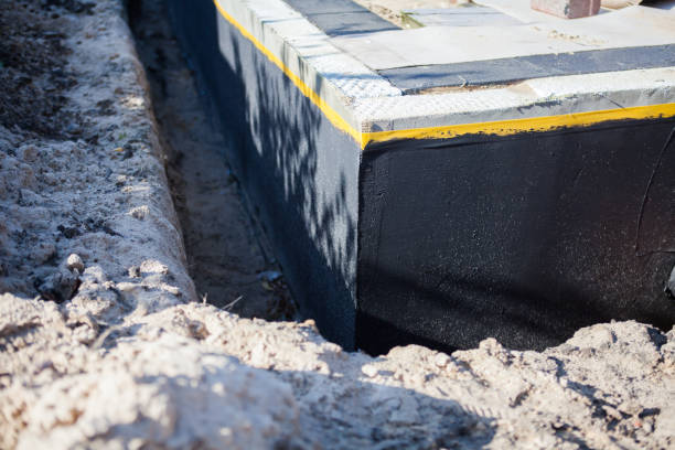Professional Waterproofing technician working in Sumner, MI